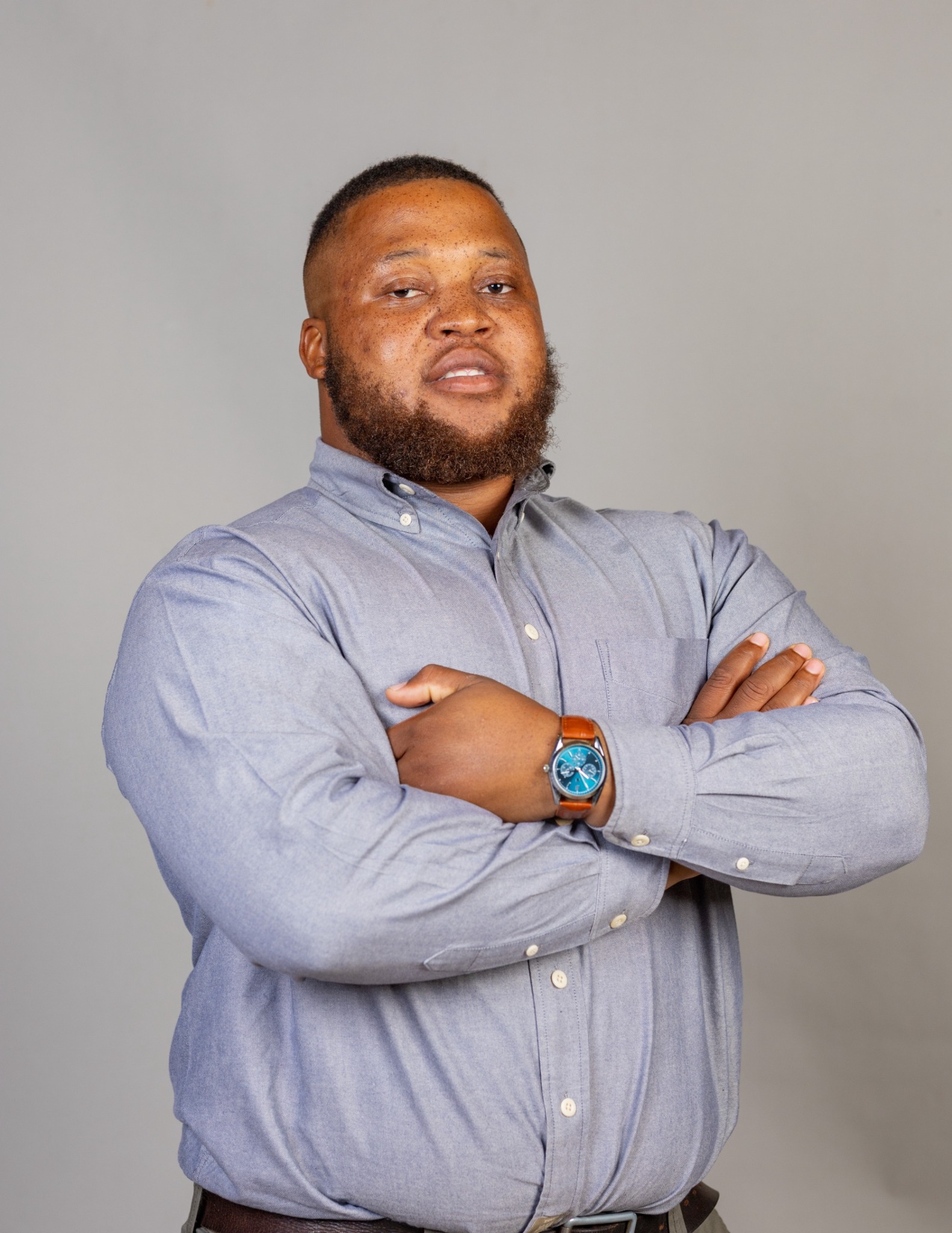 Portrait of Tawanda P Mudyiwa with arms crossed